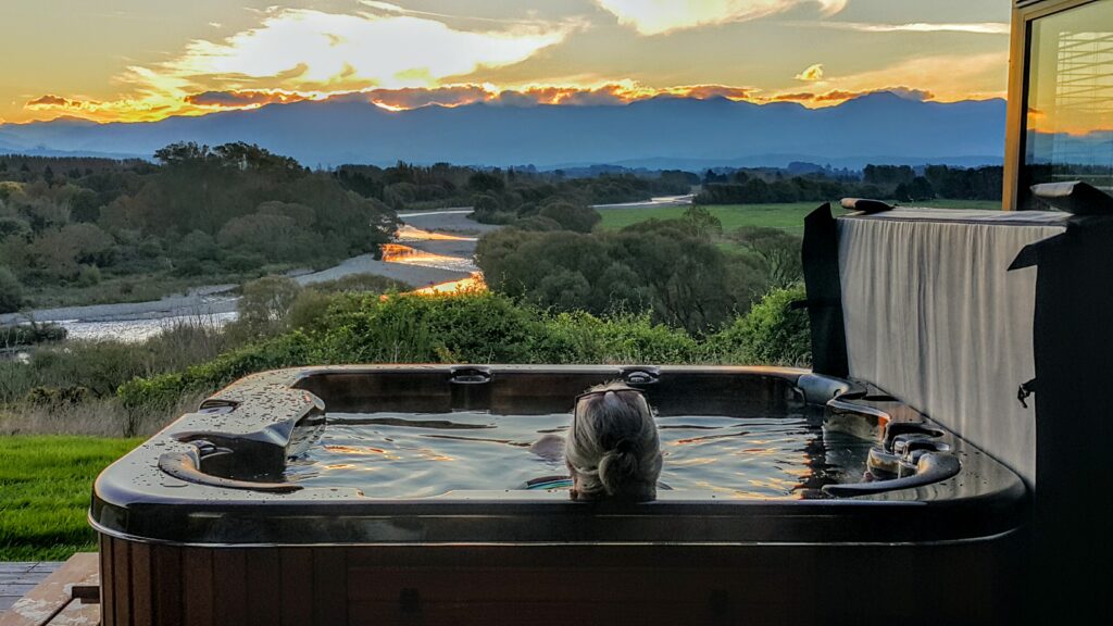 woman in spa pool at sunset